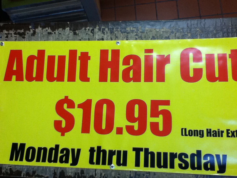 Yellow haircut promotion vinyl banner with red lettering by SpectraColor in Simi Valley