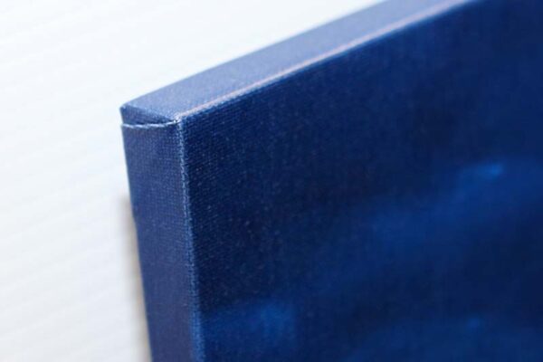 Side view of a blue gallery-wrapped canvas edge Side view of a blue gallery-wrapped canvas edge