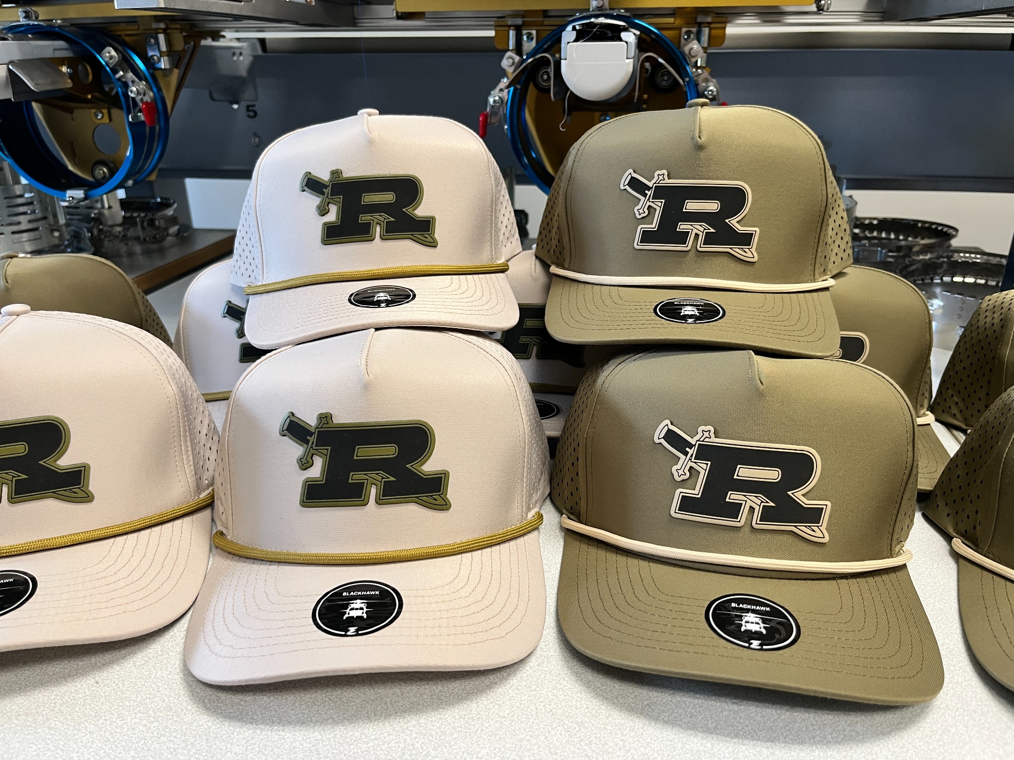Collection of cream and olive Royal High School logo patch hats