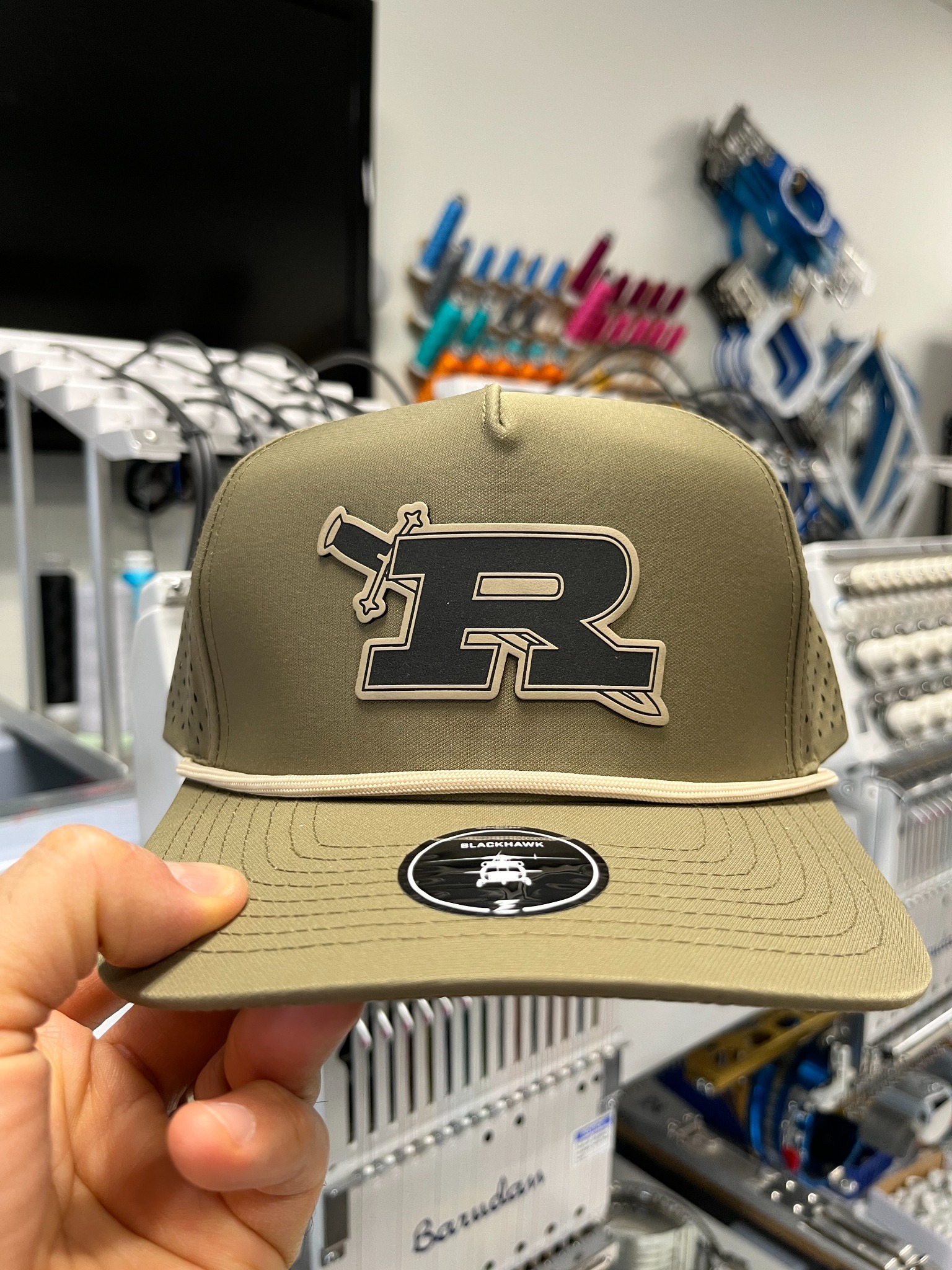 Olive Royal High School hat with a contrasting R logo patch