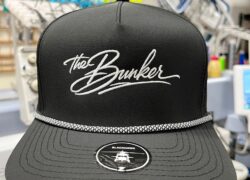 Black rope hat with white The Bunker script embroidery by SpectraColor Black rope hat with white The Bunker script embroidery by SpectraColor