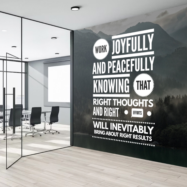 Black adhesive wall fabric print with white inspirational lettering in an office Black adhesive wall fabric print with white inspirational lettering in an office