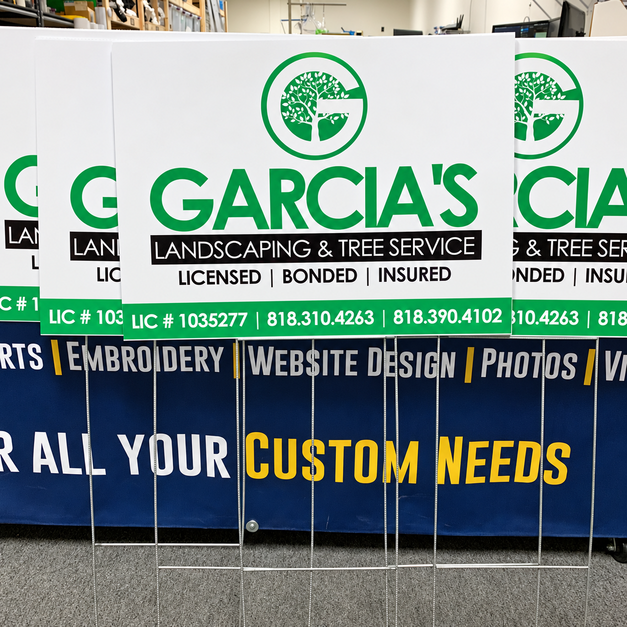 Garcia’s Landscaping and Tree Service yard signs on wire stakes for job-site branding.