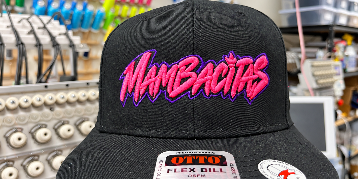 mambacitas-black-3d-puff-hat Black Mambacitas hat with pink raised embroidery and a purple outline