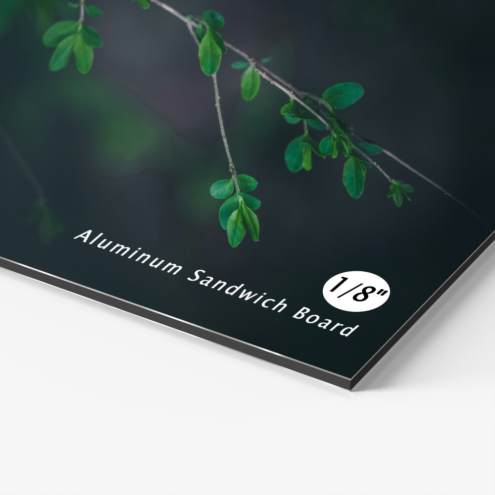 Close-up of an aluminum sandwich board sign with a printed botanical design Close-up of an aluminum sandwich board sign with a printed botanical design