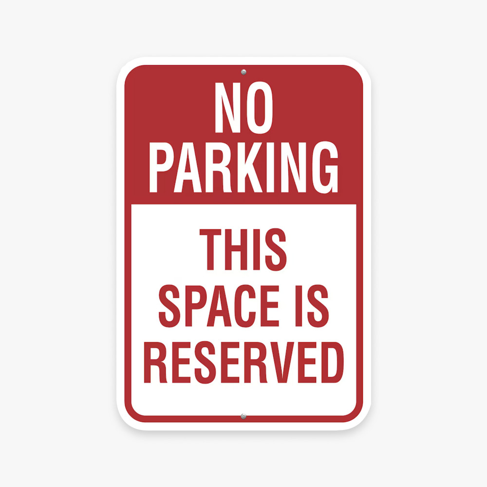 Red and white No Parking reserved space sign Red and white No Parking reserved space sign