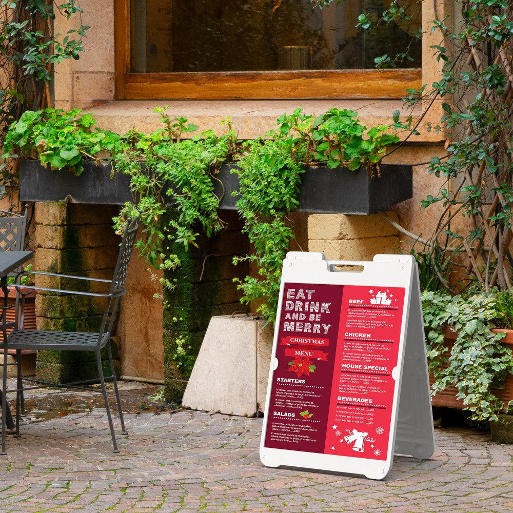 White SimpoSign II with red printed menu inserts outside a restaurant