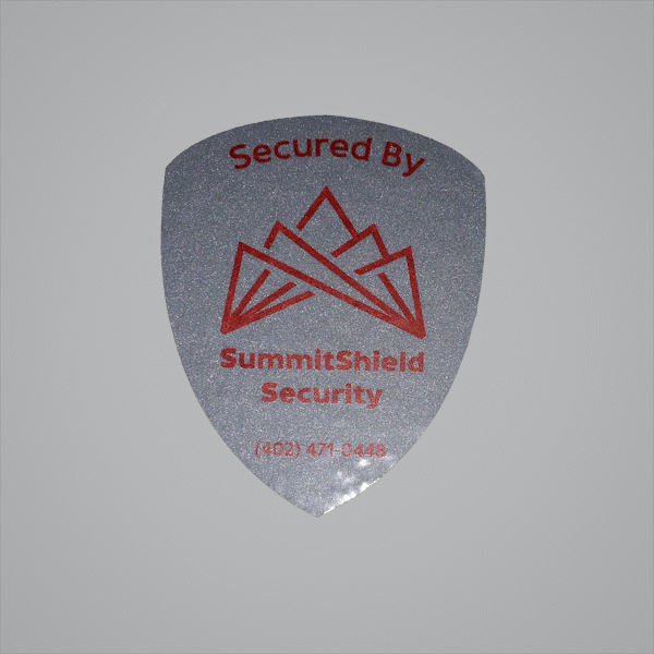 Security shield sticker with a reflective metallic finish Security shield sticker with a reflective metallic finish