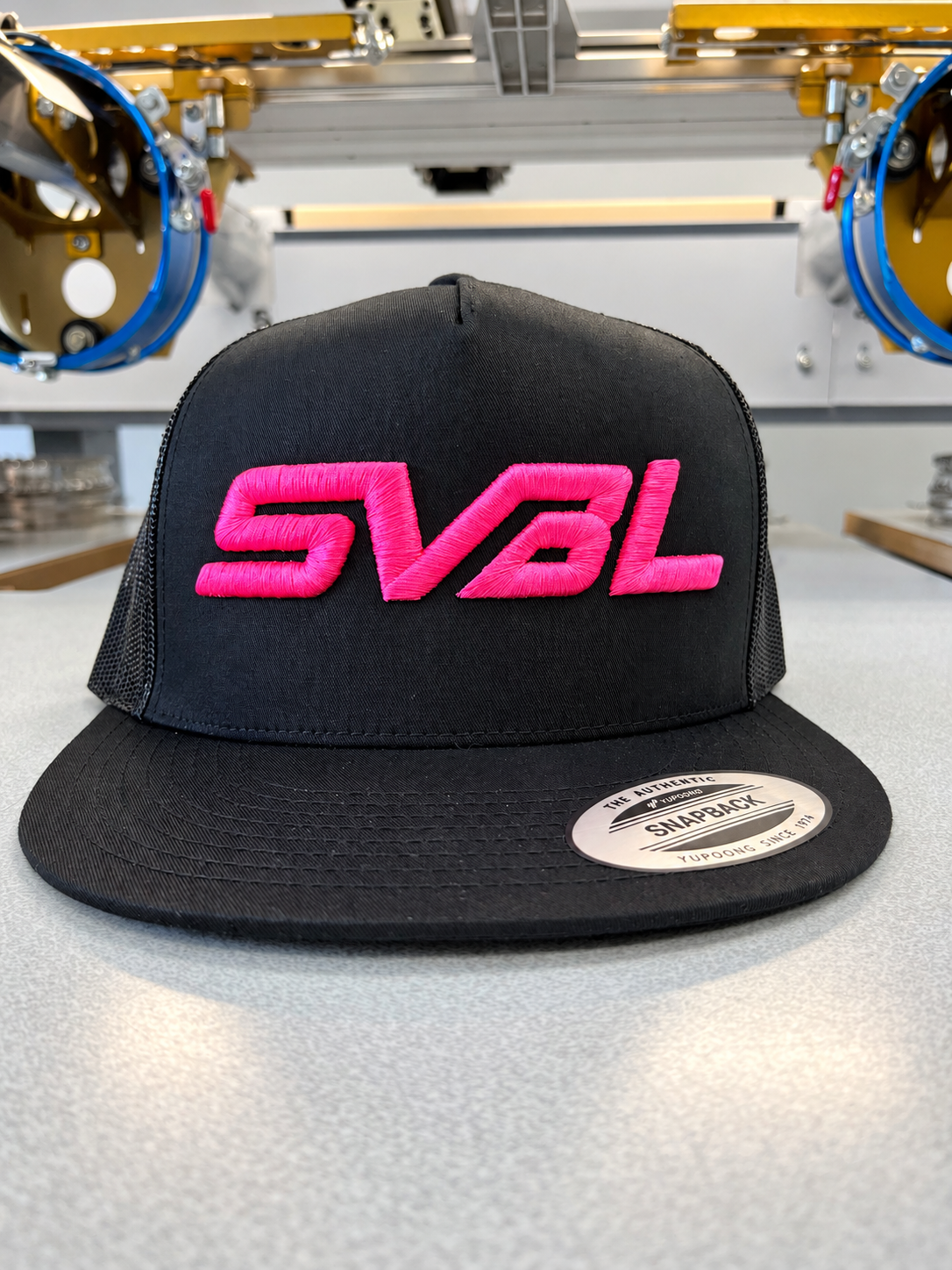 Black Simi Valley Baseball League snapback with bright pink SVBL puff embroidery