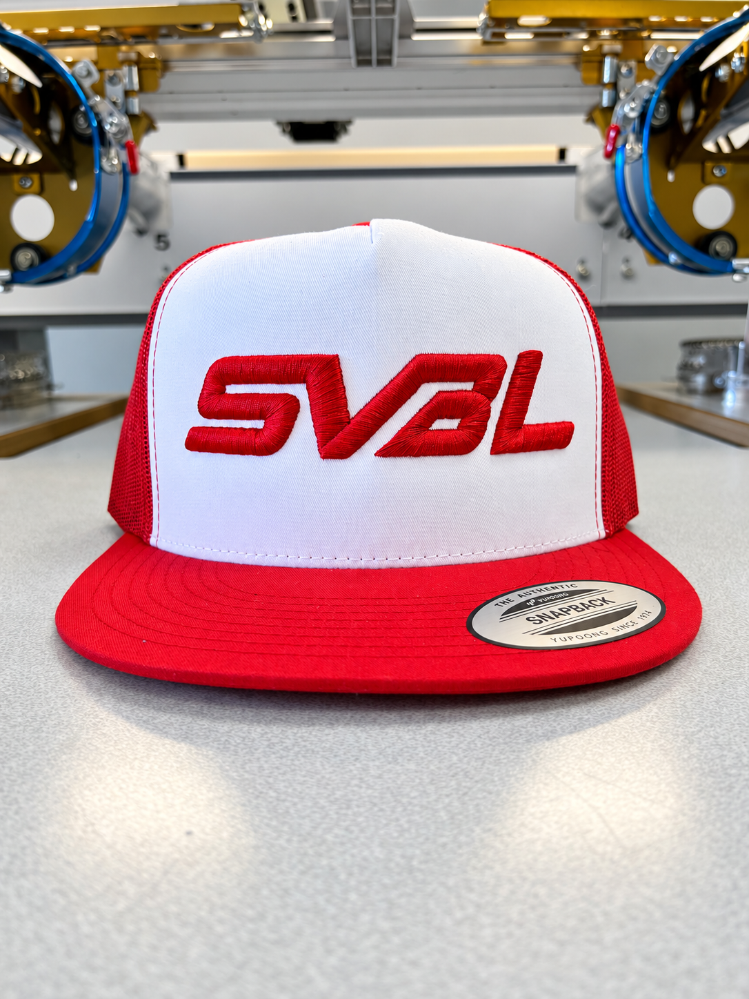 Red and white Simi Valley Baseball League hat with red raised SVBL embroidery