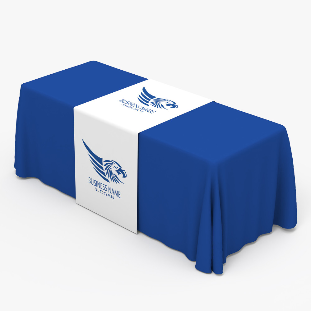 White printed table runner over a blue table throw White printed table runner over a blue table throw